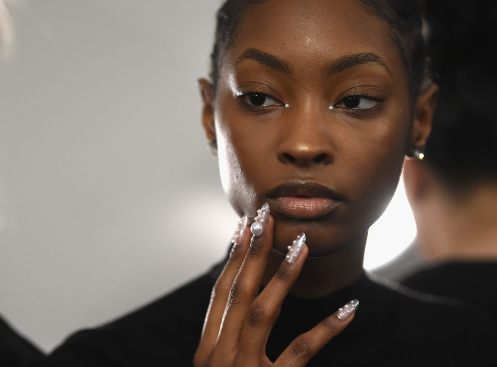 NEW YORK, NY - FEBRUARY 09:  A model prepares backstage for Adeam fashion show during New York Fashion Week: The Shows at Gallery II at Spring Studios on February 9, 2019 in New York City.  (Photo by Jamie McCarthy/Getty Images for NYFW: The Shows)